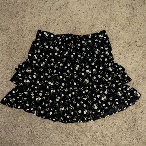 Women’s black floral mini skirt. Never worn new with tags